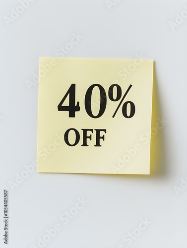 Black '40% OFF' Text on a Light Yellow Square Paper Note. White Background 