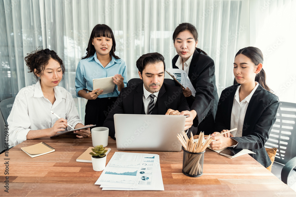 Diverse of business people from various ethnic group working in modern office environment. Productive and multi ethnic office workers engage in discussion for strategic business marketing. Meticulous Diverse of business people from various ethnic group working in modern office environment. Productive and multi ethnic office workers engage in discussion for strategic business marketing. Meticulous