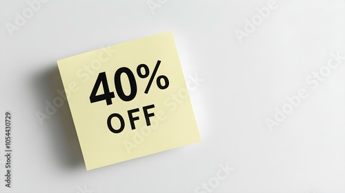 Black '40% OFF' Text on a Light Yellow Square Paper Note. White Background with Copy Space