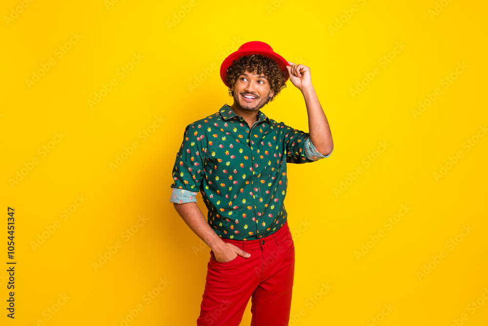 Portrait of nice elegant young man look empty space wear shirt isolated on yellow color background Portrait of nice elegant young man look empty space wear shirt isolated on yellow color background