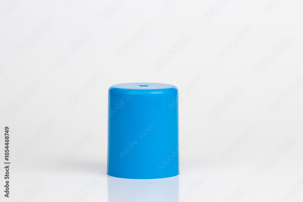 Cyan plastic cylindrical cap, cylinder shaped object, solid side up, isolated on white background. Cyan plastic cylindrical cap, cylinder shaped object, solid side up, isolated on white background.