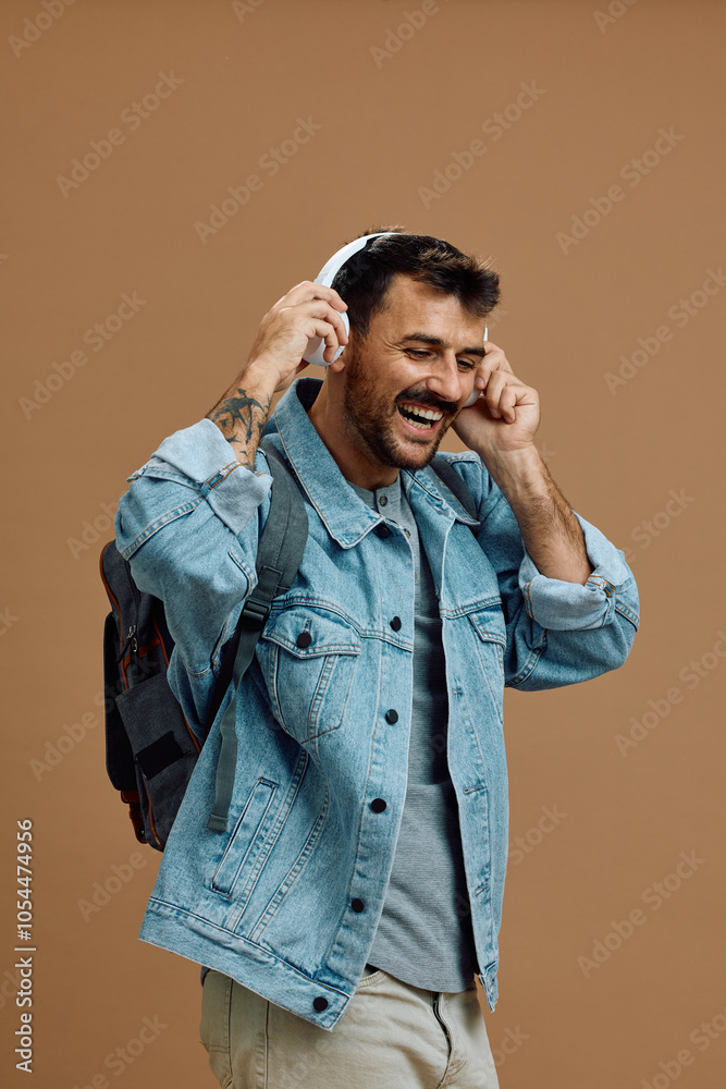 Studio shot of happy man enjoying in music over headphones. Studio shot of happy man enjoying in music over headphones.