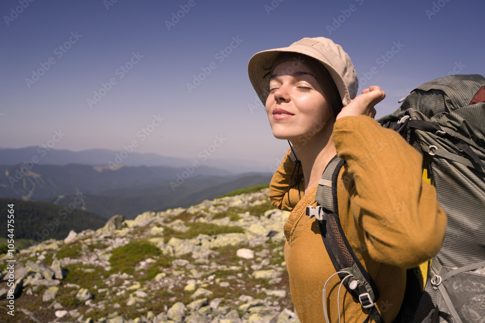A young girl travels, is engaged in active sports, climbs with trekking poles in atmospheric weather, A young girl travels, is engaged in active sports, climbs with trekking poles in atmospheric weather,