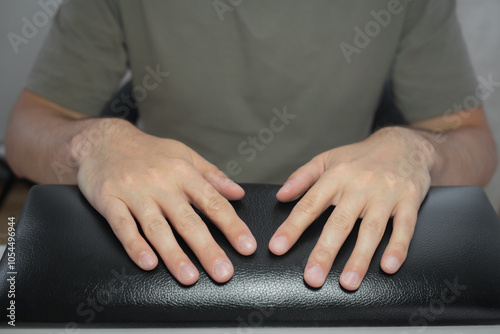 Obraz na płótnie Male hands with beautiful natural elegant manicure. Manicure in a luxury beauty SPA salon. Concept nails and hands care w salonie