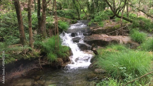 Mountain river, water running with small falls between the rocks, Leça river, in the north of Portugal