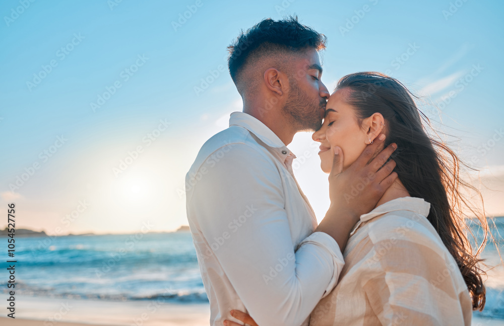 Kiss, beach and couple hugging for travel, getaway or holiday for romance together with care. Love, travel and young man and woman embracing by tropical ocean on date on seaside summer weekend trip. Kiss, beach and couple hugging for travel, getaway or holiday for romance together with care. Love, travel and young man and woman embracing by tropical ocean on date on seaside summer weekend trip.
