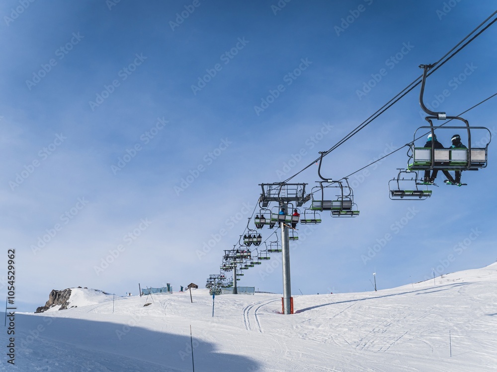 Ski lift on a sunny winter day in Serre Chevalier Ski lift on a sunny winter day in Serre Chevalier