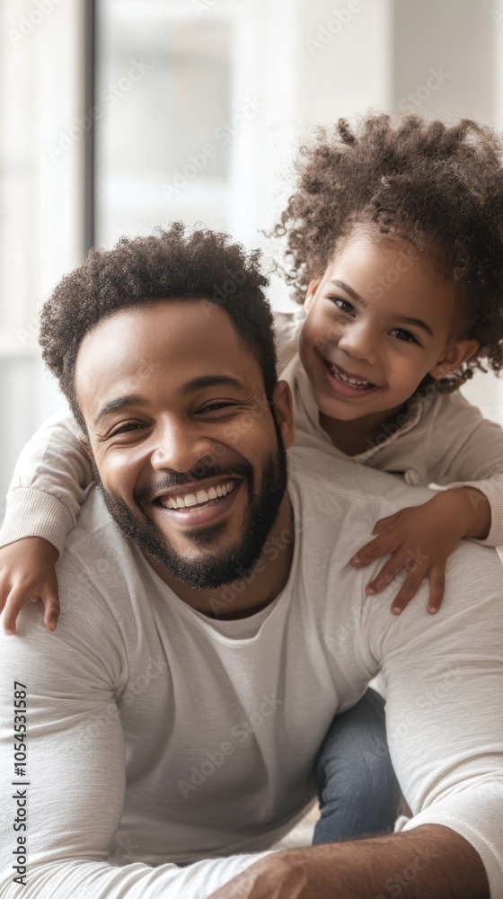 Happy father playing with daughter in cozy indoor setting Happy father playing with daughter in cozy indoor setting