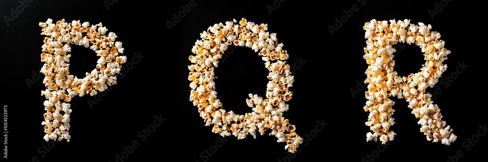 Letters P, Q, R. Alphabet Made of Popcorn on Black Background. Letters P, Q, R. Alphabet Made of Popcorn on Black Background.