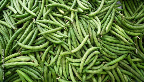 Buncis or Green Beans Vegetables, Creative background design with food theme, focus on the pile of fresh Buncis or Green Beans