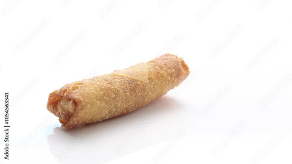 Crispy, freshly deep-fried spring roll appetizer from Chinese cuisine on a white background.