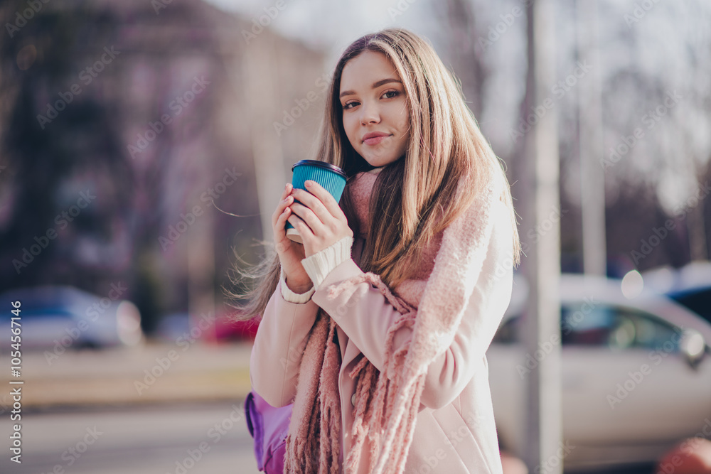 Photo of pretty young girl hold enjoy fresh coffee cup outerwear coat walk city center street outdoors Photo of pretty young girl hold enjoy fresh coffee cup outerwear coat walk city center street outdoors