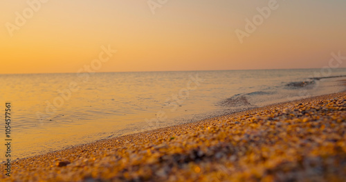 Landscape, travel destinations, enjoying holiday, Sea, vacantion seaside. Bright golden waves at sunset on the beach the black sea. photo