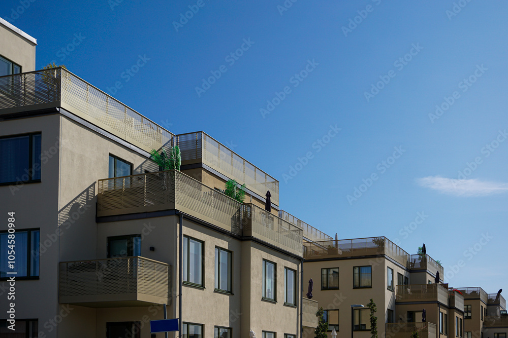 Fototapeta premium Low angle view of modern apartment buildings against sky in Sollentuna