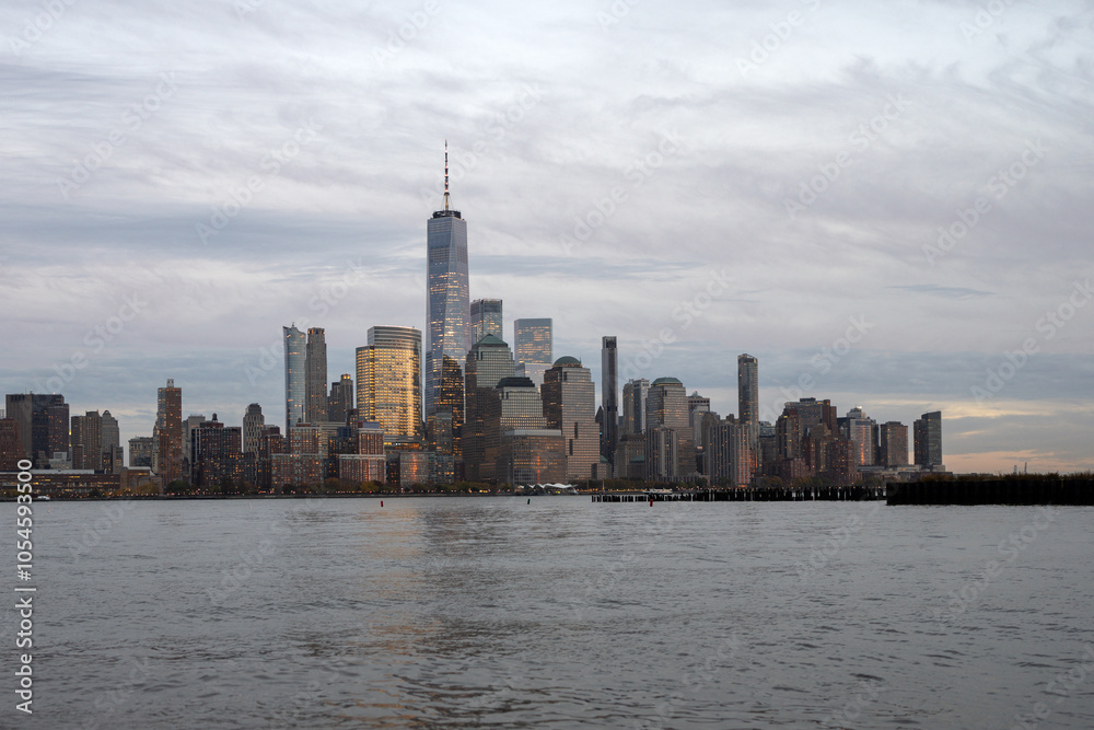 Fototapeta premium NYC, NY. New York City Skyline with Urban Skyscrapers USA. Lower Manhattan and One World Trade Center in New York City, USA as seen from Weehawken New Jersey Panoramic view on Manhattan.