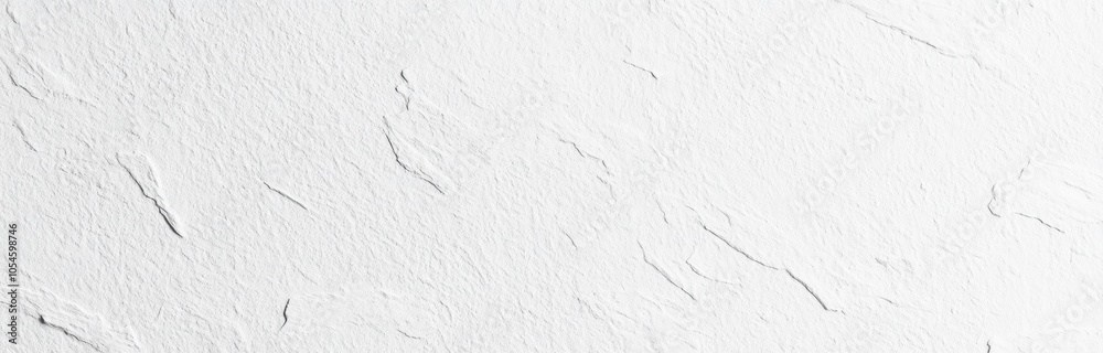 A textured white wall surface with subtle patterns and variations. A textured white wall surface with subtle patterns and variations.