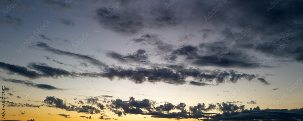 Obraz premium Clouds background. Dramatic Clouds Sunset Background. Sky with clouds in Sunrise. Sunrise with clouds in various shapes background. Calm Cloud.