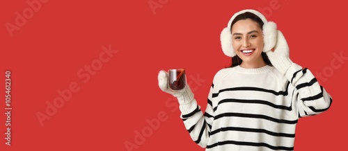 Happy young woman holding g...