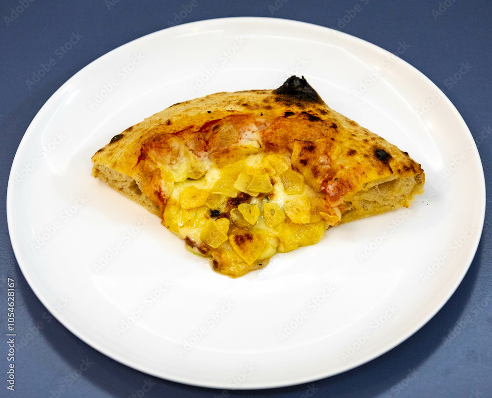 Traditional rustic pizza made with four cheeses, garlic and oil and pear with gorgonzola Traditional rustic pizza made with four cheeses, garlic and oil and pear with gorgonzola