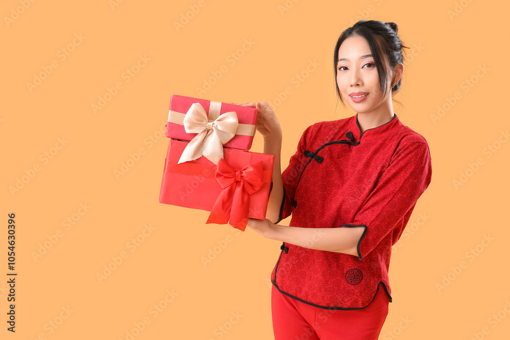 Young Asian woman with gifts on yellow background. Chinese New Year celebration Young Asian woman with gifts on yellow background. Chinese New Year celebration