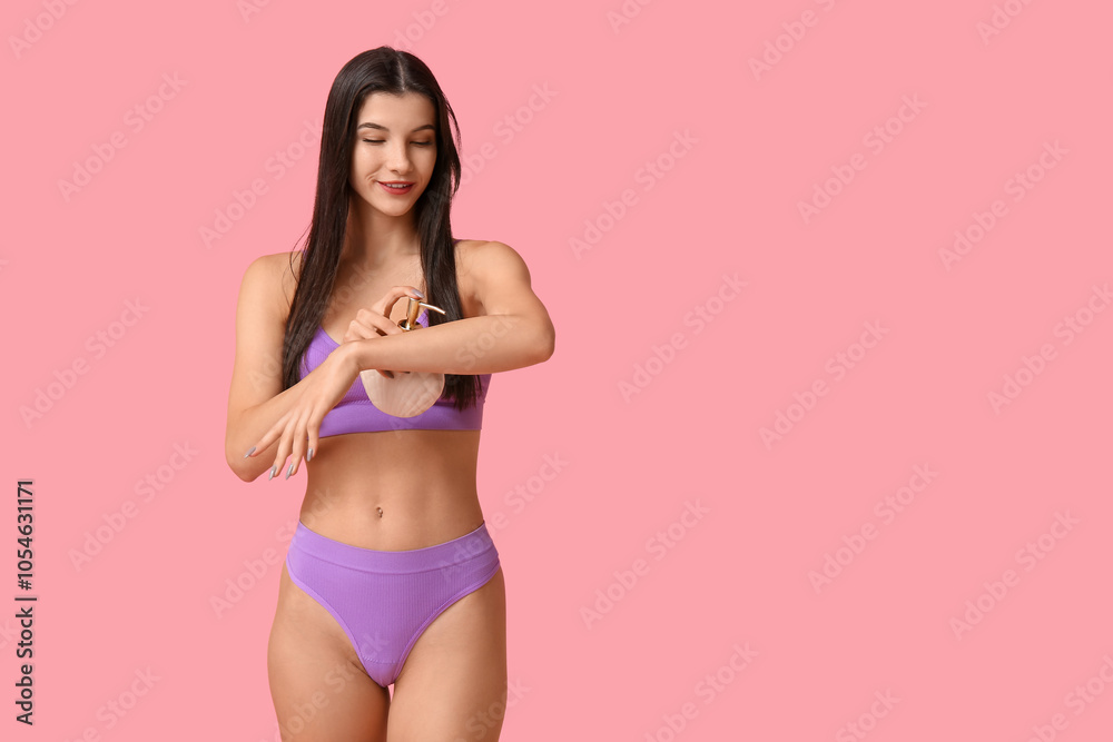 Beautiful young happy woman with bottle of liquid soap on pink background Beautiful young happy woman with bottle of liquid soap on pink background