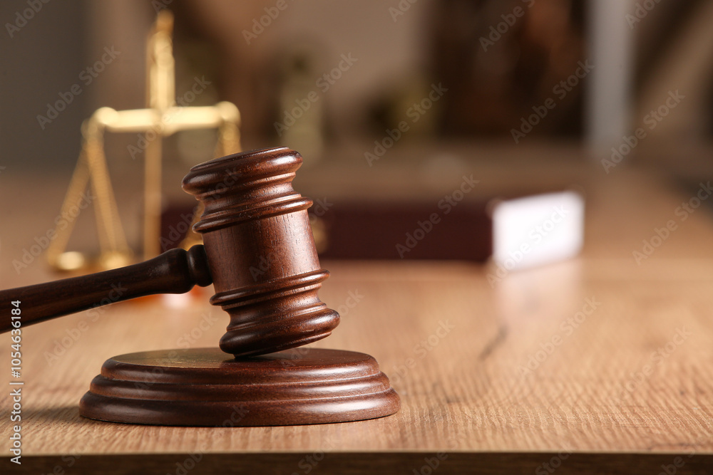 Judge's gavel on light table in office, closeup Judge's gavel on light table in office, closeup