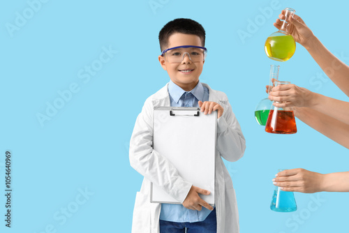 Cute little boy holding cli...