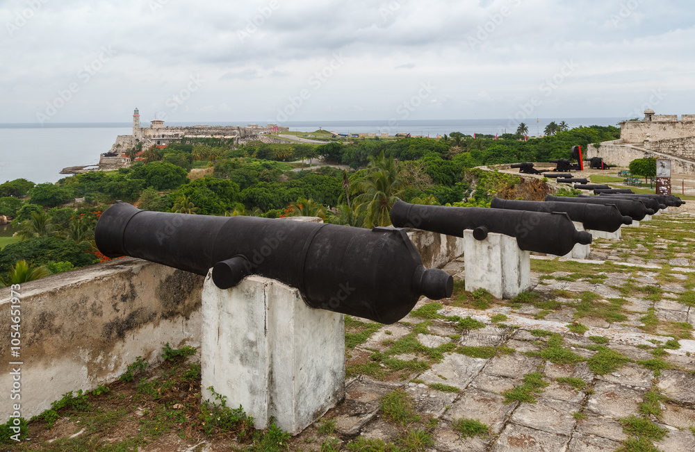 Cannons at San Carlos de La Cabana Fortress and Castillo del Morro with its Lighthouse, La Habana (Havana), Cuba Cannons at San Carlos de La Cabana Fortress and Castillo del Morro with its Lighthouse, La Habana (Havana), Cuba