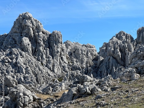 Rocky ridge of Tulove grede or karst mountain peak of Tulovice - Velebit Nature Park, Croatia (Stjenoviti greben Tulove grede ili krški planinski vrh Tulovice - Park prirode Velebit, Hrvatska) photo