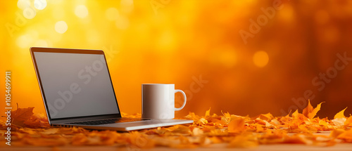 Cozy autumn scene with a laptop and coffee mug on fallen leaves, surrounded by warm orange colors.