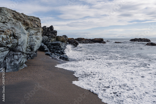 Fascinating coastal landscape with granite rocks on the beach in Iceland