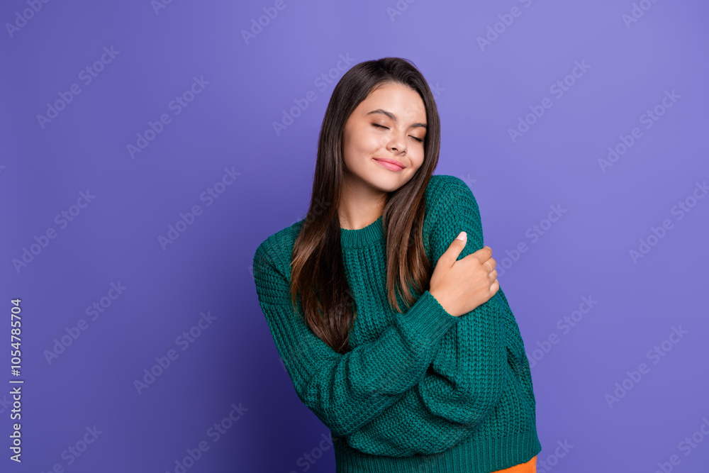 Fototapeta premium Photo of pretty young girl closed eyes hug shoulders wear pullover isolated on purple color background