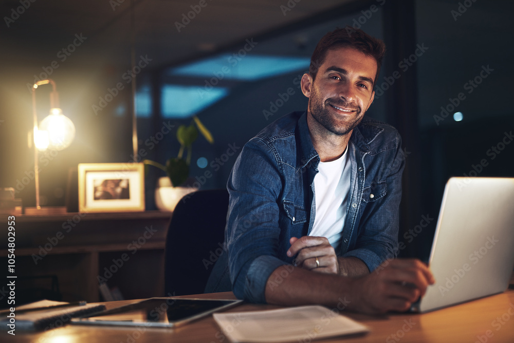 Fototapeta premium Businessman, laptop and happy for project management, networking and communication in office at night. Employee, technology and portrait for proposal, report or research with late deadline completion