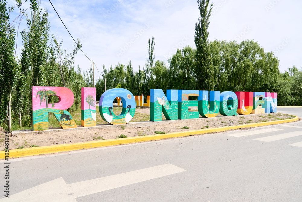 Colorful sign with the text Neuquen River, in Neuquen, Argentina Colorful sign with the text Neuquen River, in Neuquen, Argentina