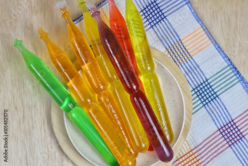 Colorful Indonesian kiko ice sticks with various flavors are served on a plate photo