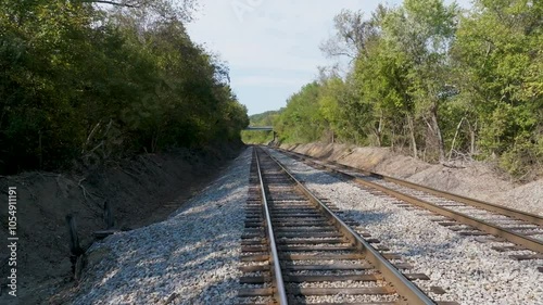 UAV low approach and dolly over double railroad tracks.