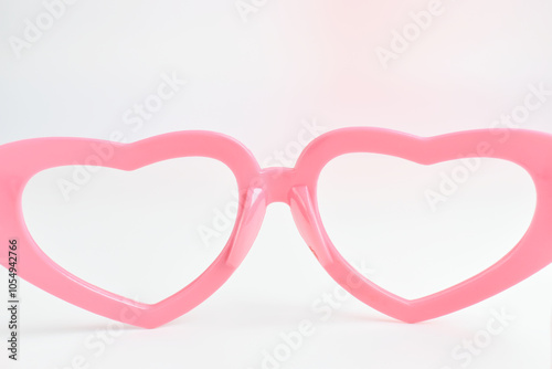 pink heart shape of glasses on white background