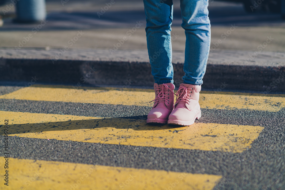Cropped portrait of young girl pink boots advert walk pedestrian crossing street outdoors Cropped portrait of young girl pink boots advert walk pedestrian crossing street outdoors