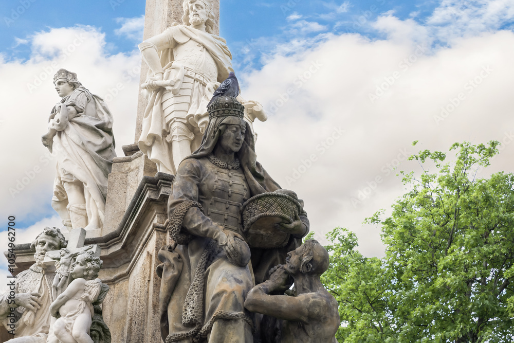 One of the sculptures at the bottom of the Marian Plague Column in garden on Hradcanska Square in Prague in Czech Republic One of the sculptures at the bottom of the Marian Plague Column in garden on Hradcanska Square in Prague in Czech Republic