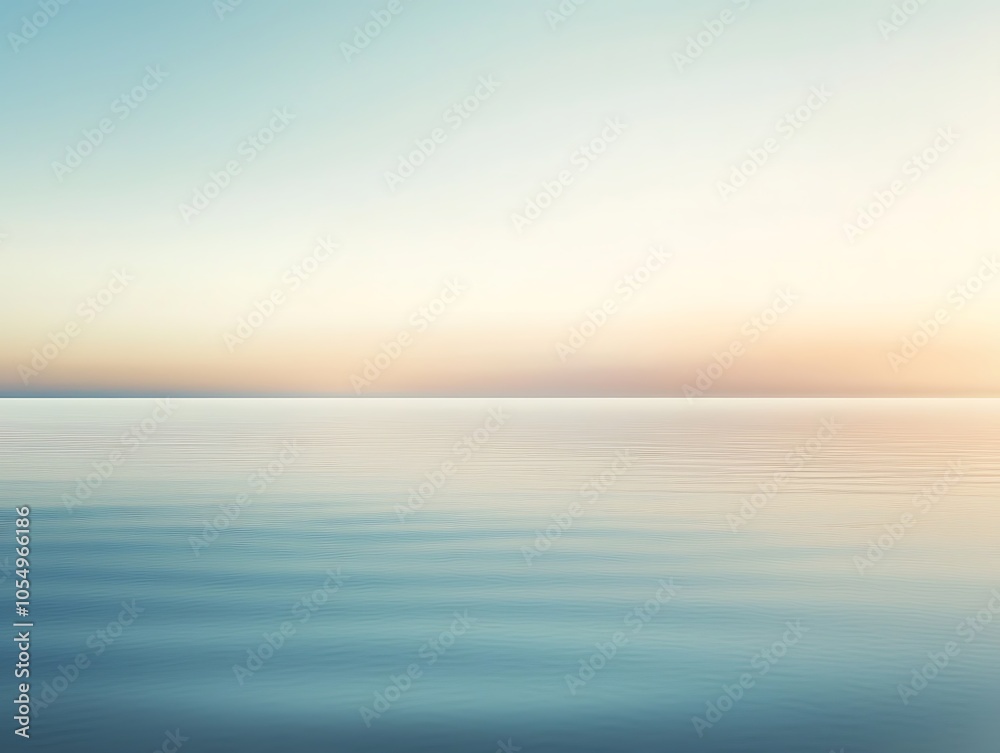 Obraz premium A serene seascape at dawn with calm waters reflecting soft pastel hues of the sky.