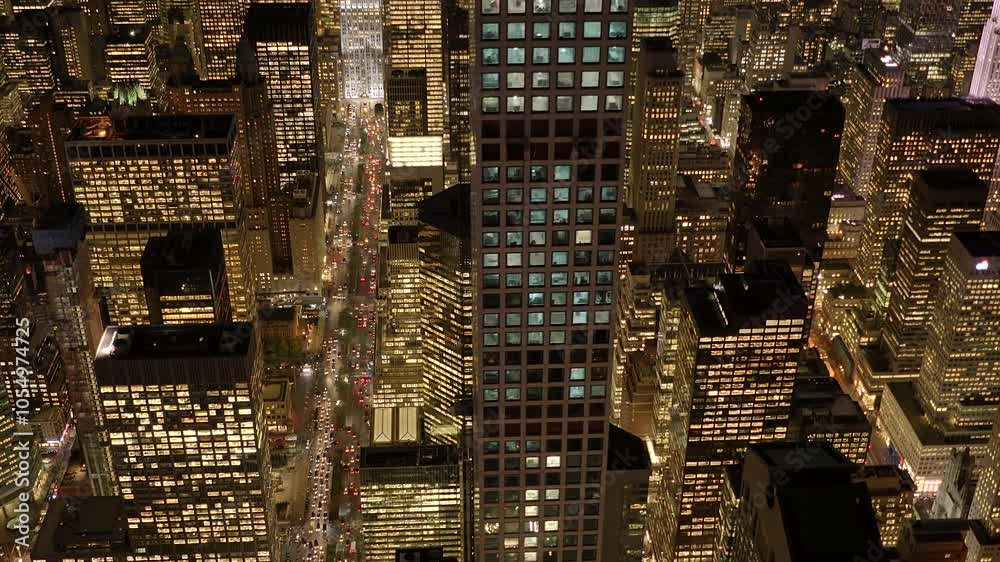 A stunning view of a city at nighttime from above, with vibrant lights and modern buildings A stunning view of a city at nighttime from above, with vibrant lights and modern buildings