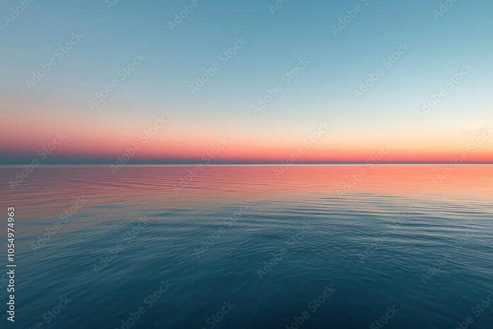 Obraz premium Calm ocean at sunset, reflecting soft hues of pink and blue across the water's surface, creating a serene atmosphere.