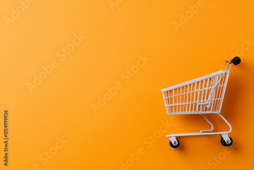 A minimalist composition featuring a single shopping cart isolated against a bold orange background, symbolizing modern commerce and consumerism in a striking visual.