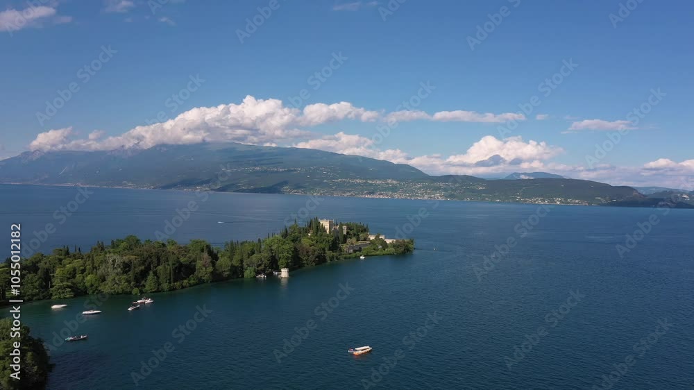 Drone view of Isola del Garda, Lake Garda, Italy. Enjoy breathtaking lake views and scenic beauty at Isola del Garda, a top tourist attraction in Lombardy, Italy. Drone view of Isola del Garda, Lake Garda, Italy. Enjoy breathtaking lake views and scenic beauty at Isola del Garda, a top tourist attraction in Lombardy, Italy.