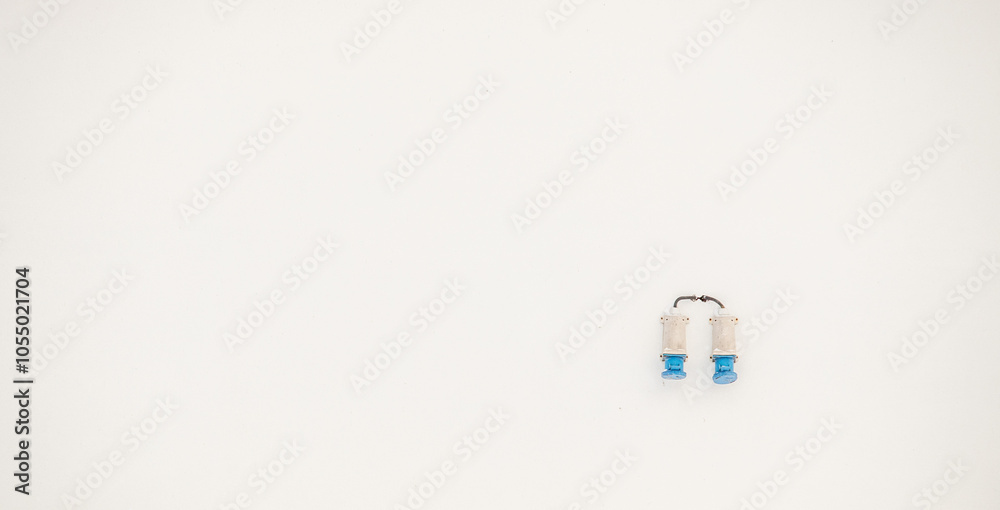 Two blue and white objects are on a white background Two blue and white objects are on a white background