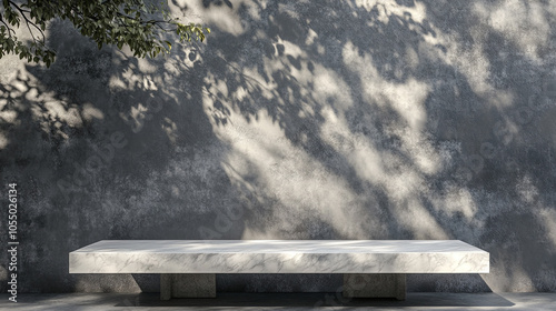 A minimalist scene featuring a sleek white marble table set against a textured gray wall