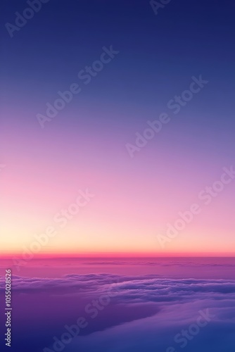 A serene aerial view of soft clouds bathed in a gradient of pastel colors during sunset, creating a tranquil and picturesque atmosphere.