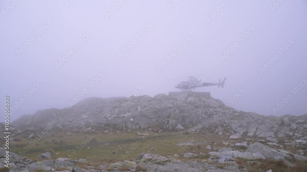 Fast clouds passing by a mountain landscape with a parked helicopter. Fast clouds passing by a mountain landscape with a parked helicopter.