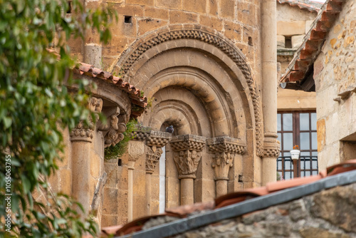 Architectural details of the romanesque Collegiate Church of Santillana or Colegiata de Santa Juliana in the medieval little town Santillana del Mar, Cantabria region in Northern Spain photo