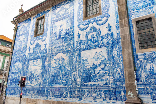Picturesque historic Azulejo tiles at the exterior of chapel Almas de Santa Catarina in Porto photo